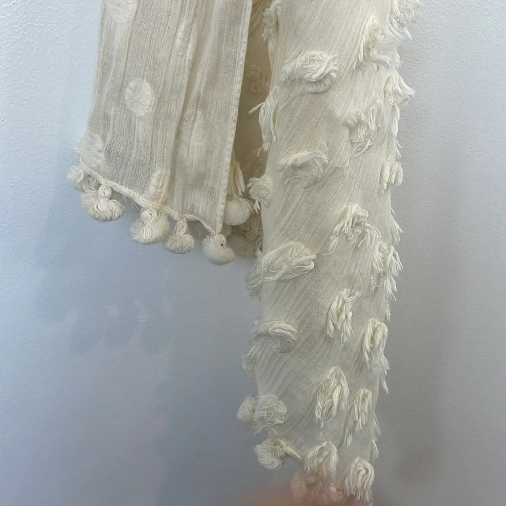 Banana Republic cream lightweight scarf or wrap with Pom Pom ball detail.